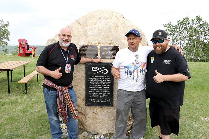 Will Goodon of Manitoba Métis Federation Southwest Region (MMFS), Terry Haney, president of Manitoba Métis Federation (MMF) Fort-Ellice local and Devon Gurniak resident of St. Lazare at the Fort Ellice monument.<br />
